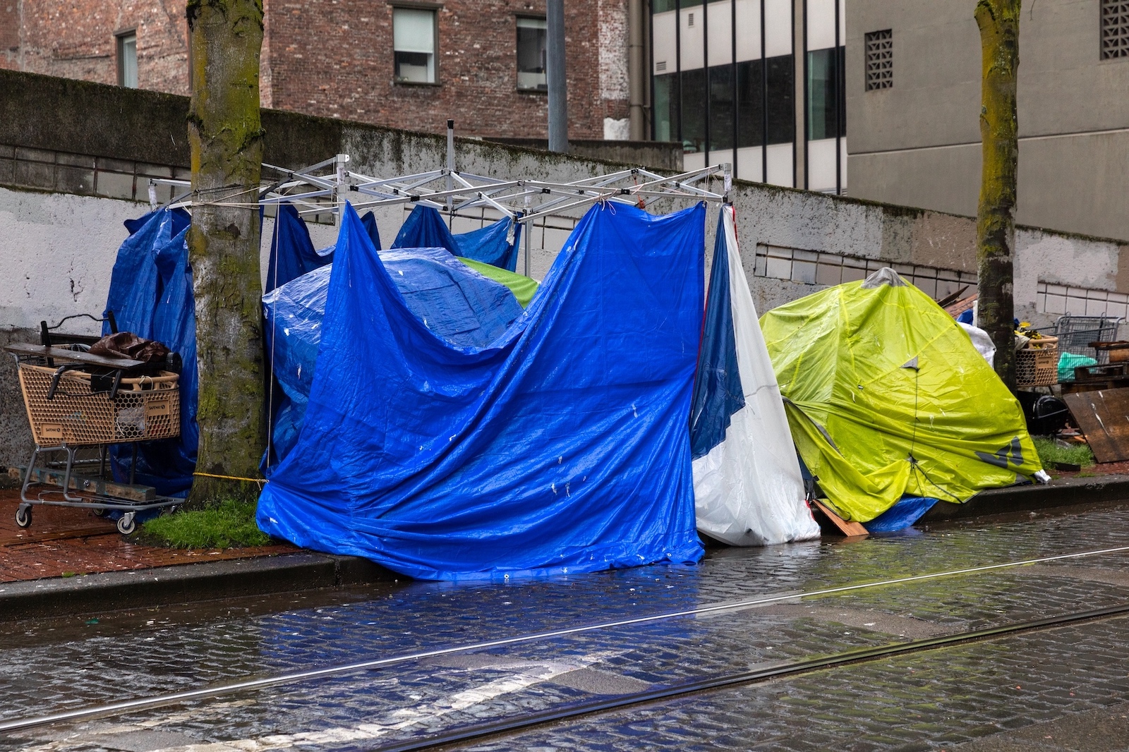 Portland, OR, USA-March 14, 2022: Homeless camps with tents in the streets of Downtown Portland, Oregon